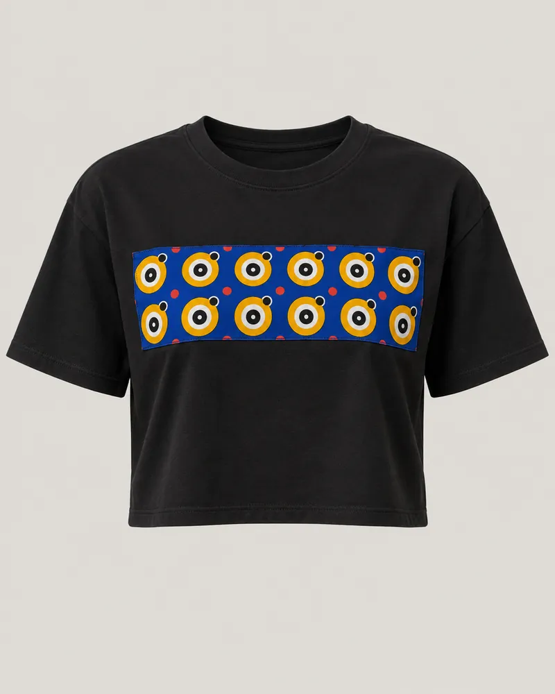 Solid black cropped T-shirt with a sewn wax chest panel, front view. AI-generated product concept.