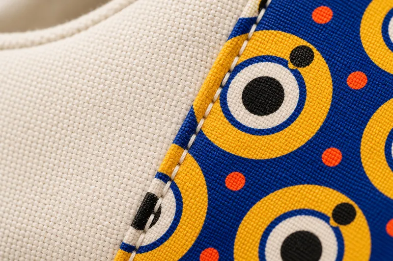 Sneakers: a sewn signature. AI-generated construction detail.